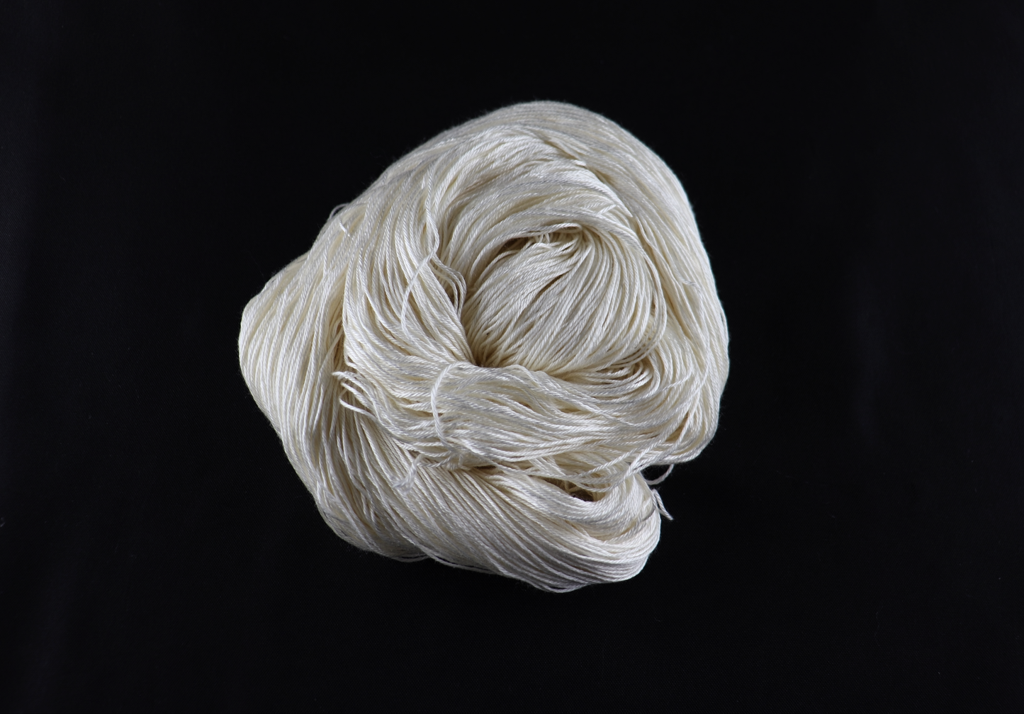 cone of white yarn