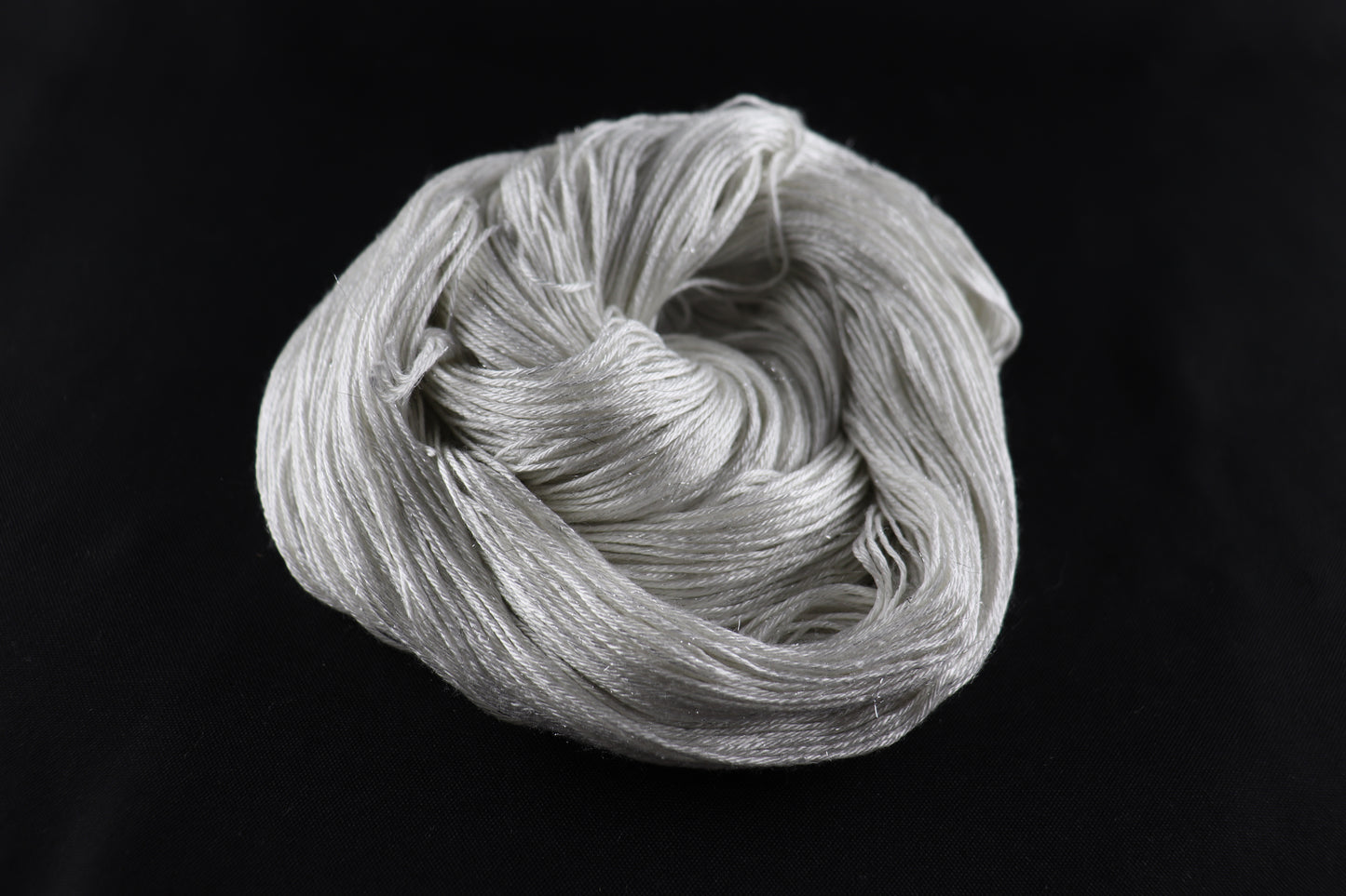 cone of white yarn