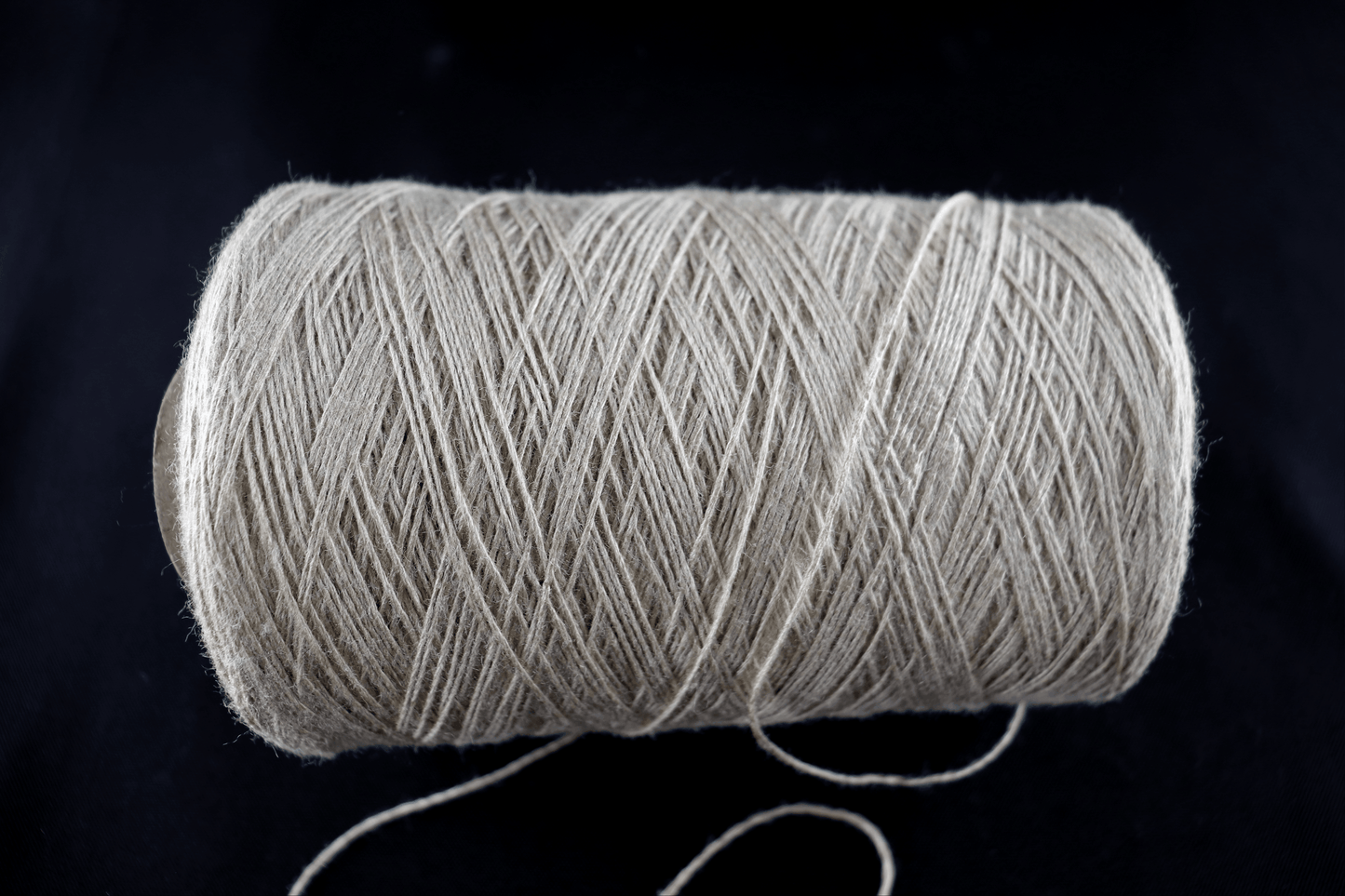 cone of white yarn