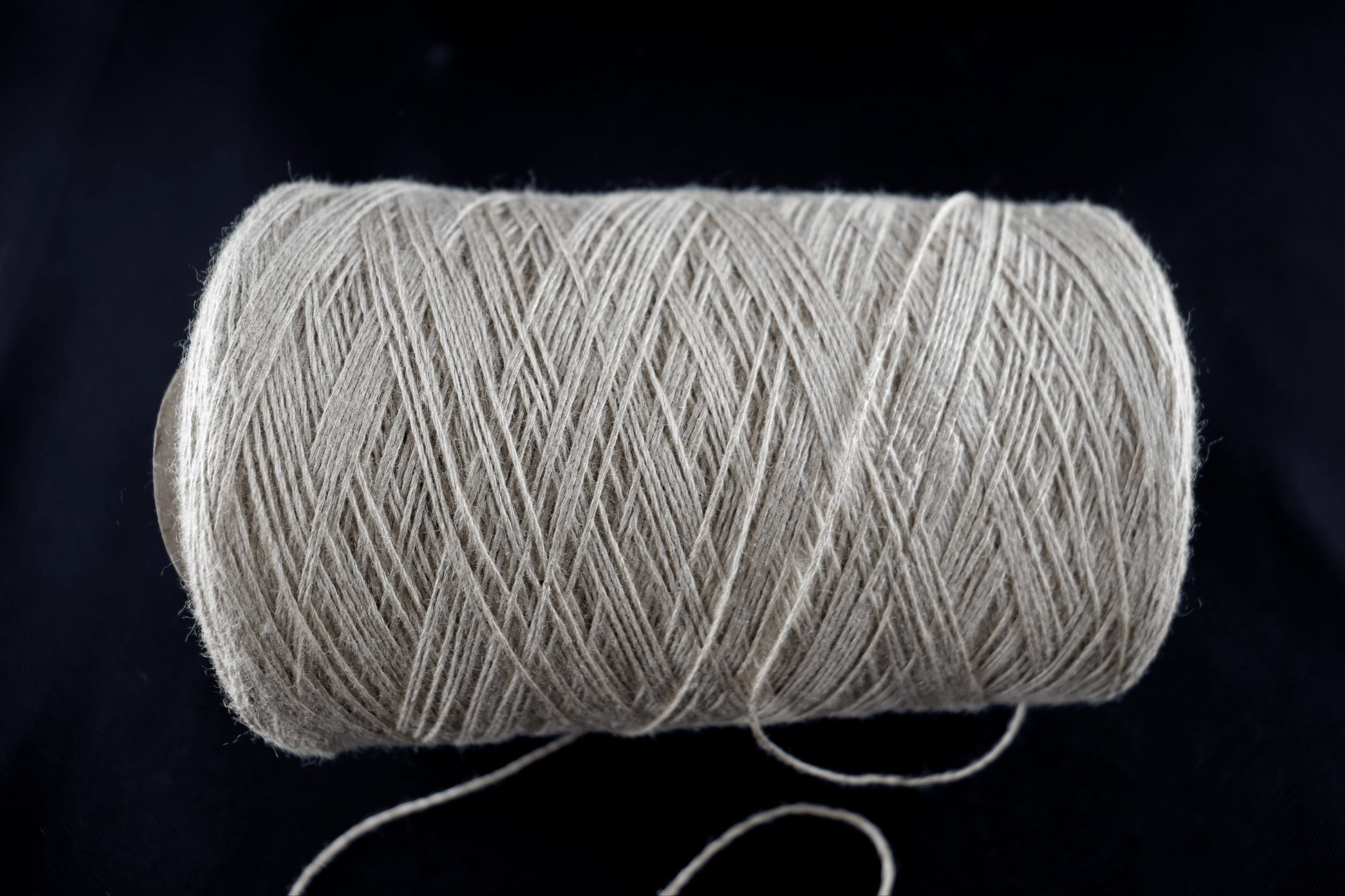 cone of white yarn