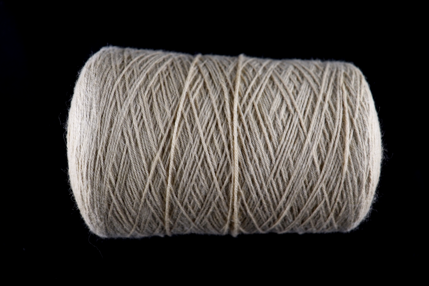 cone of white yarn