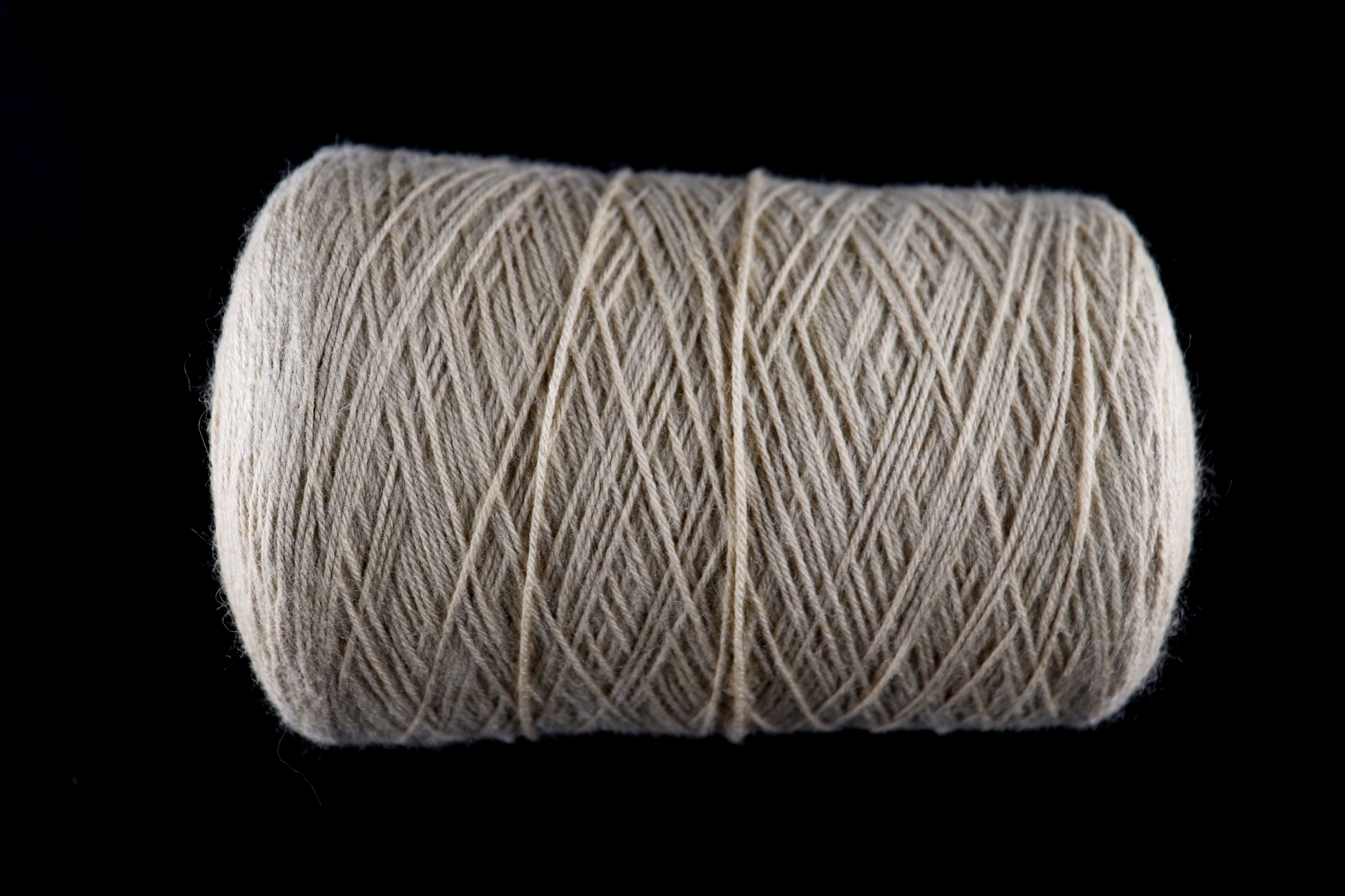cone of white yarn