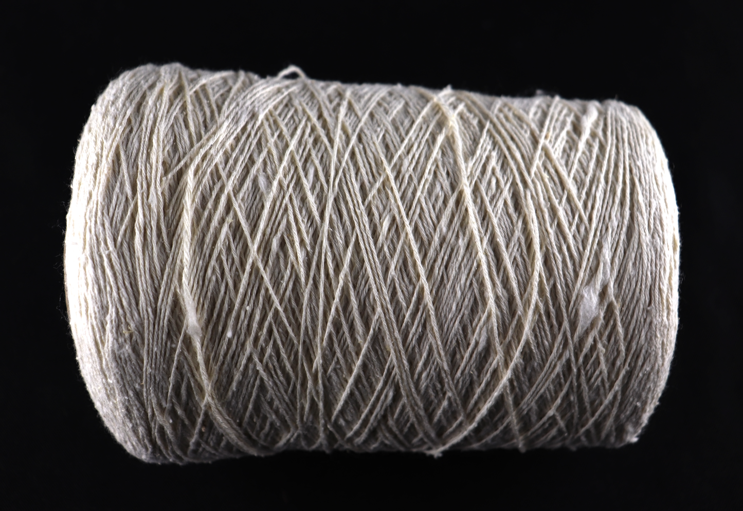 cone of white yarn