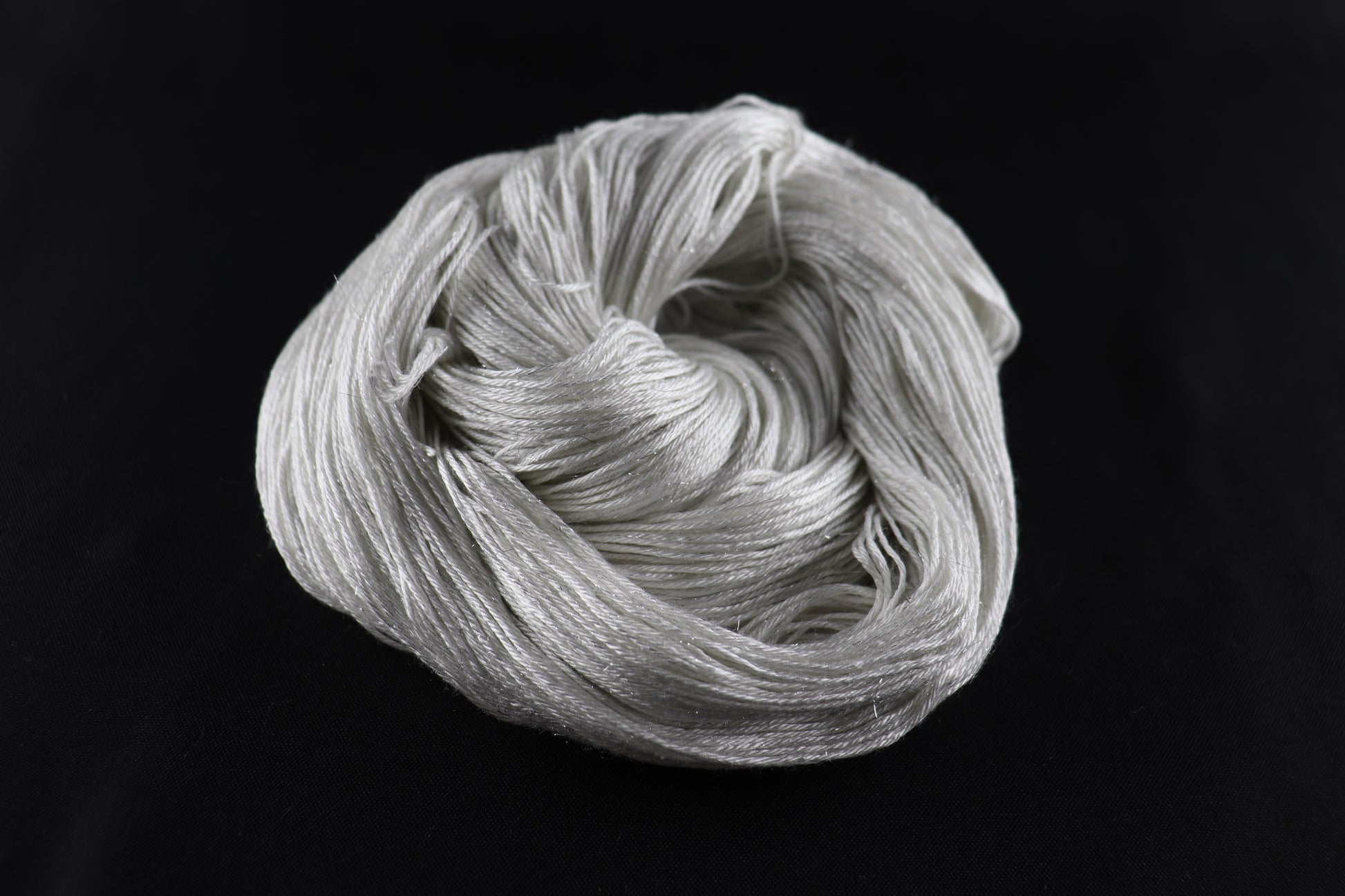 cone of white yarn