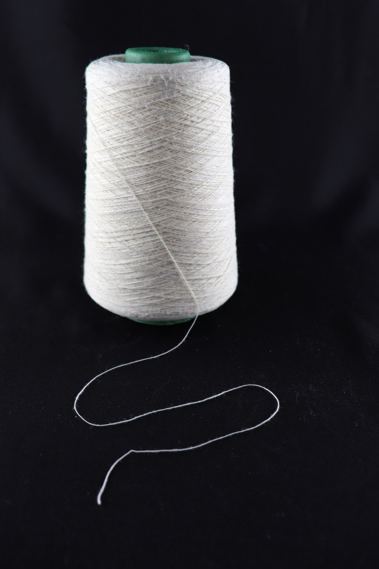 cone of white yarn