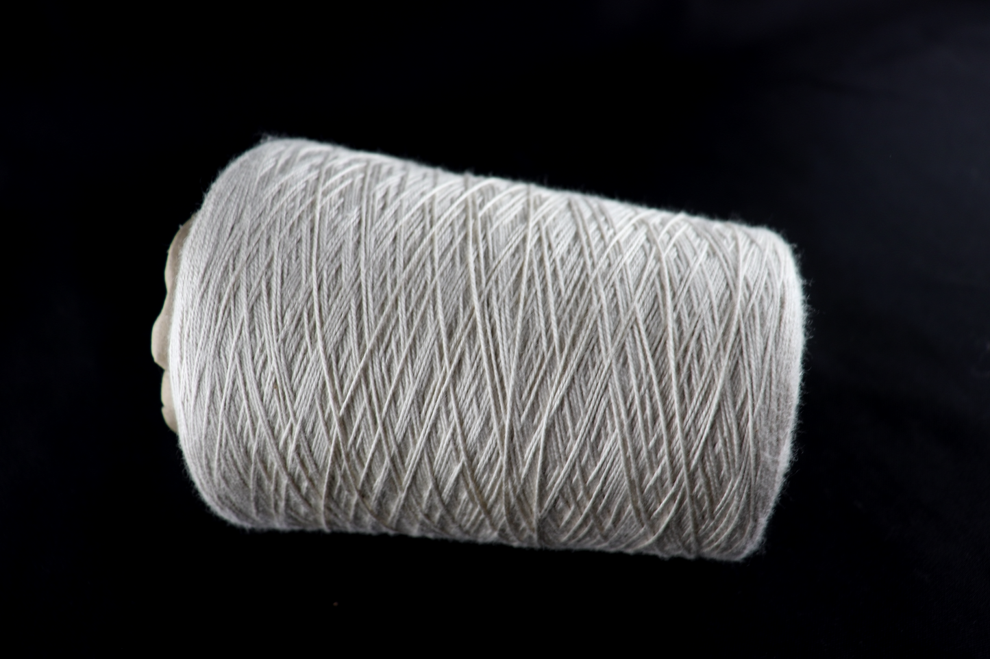 cone of white yarn