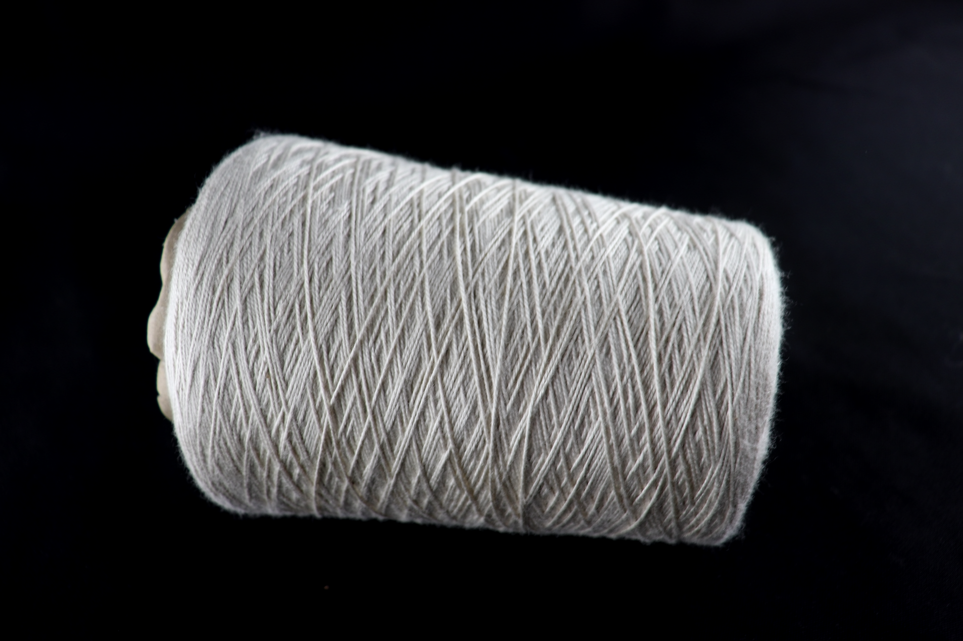 cone of white yarn