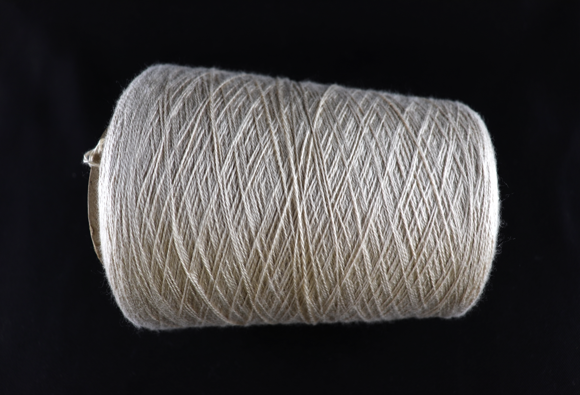 cone of white yarn