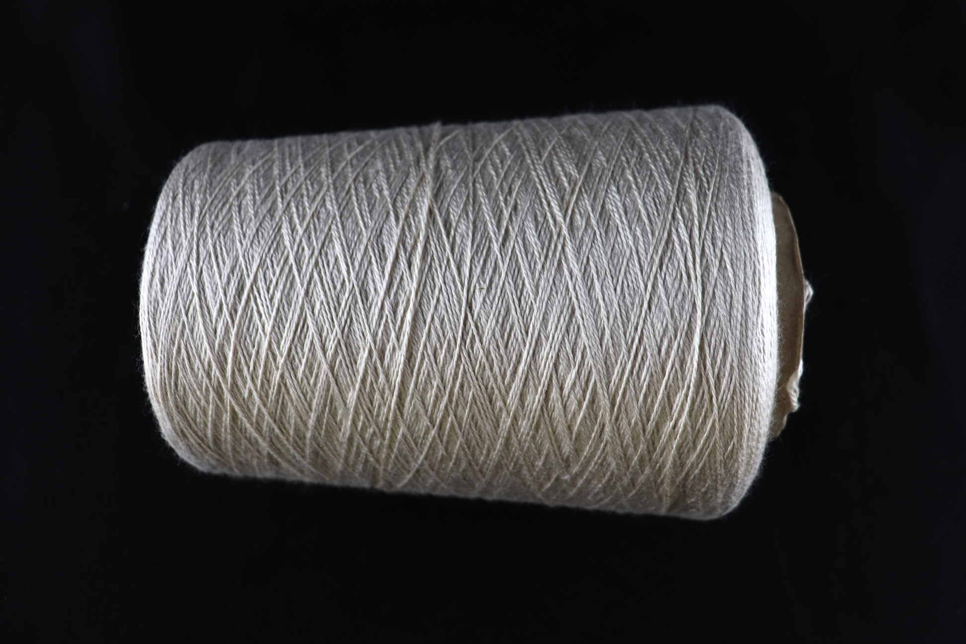 cone of white yarn