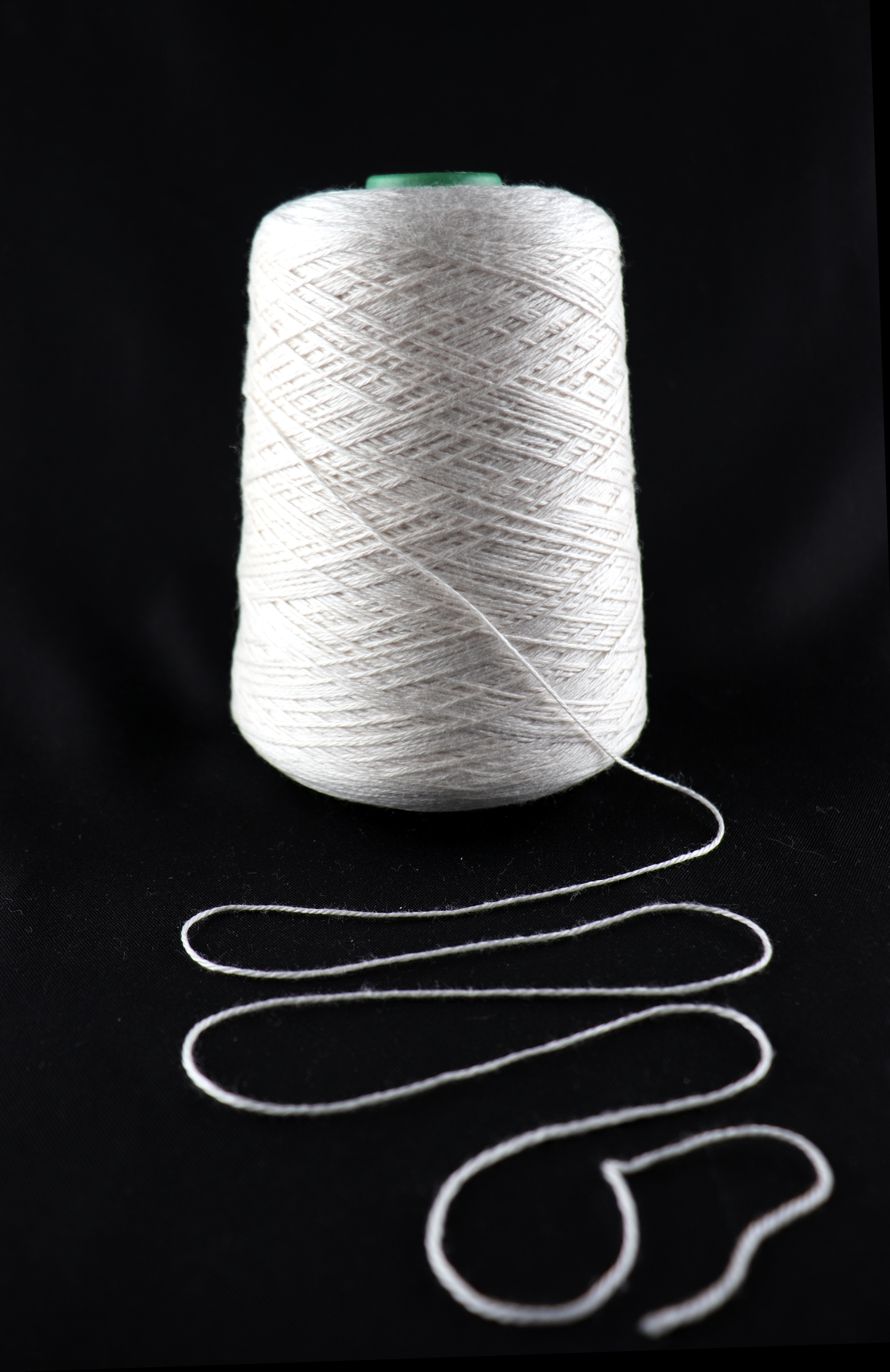 cone of white yarn