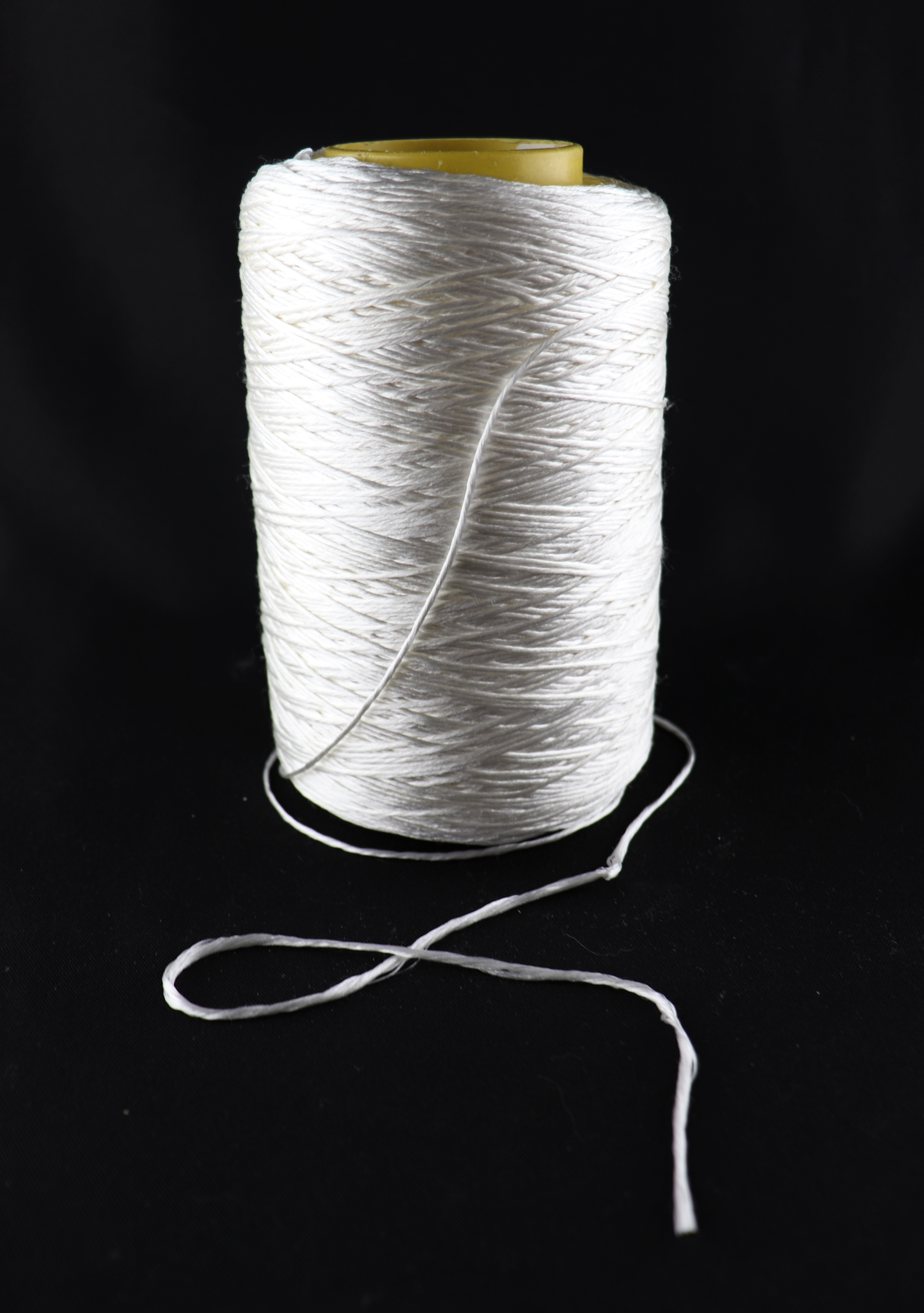 cone of white yarn