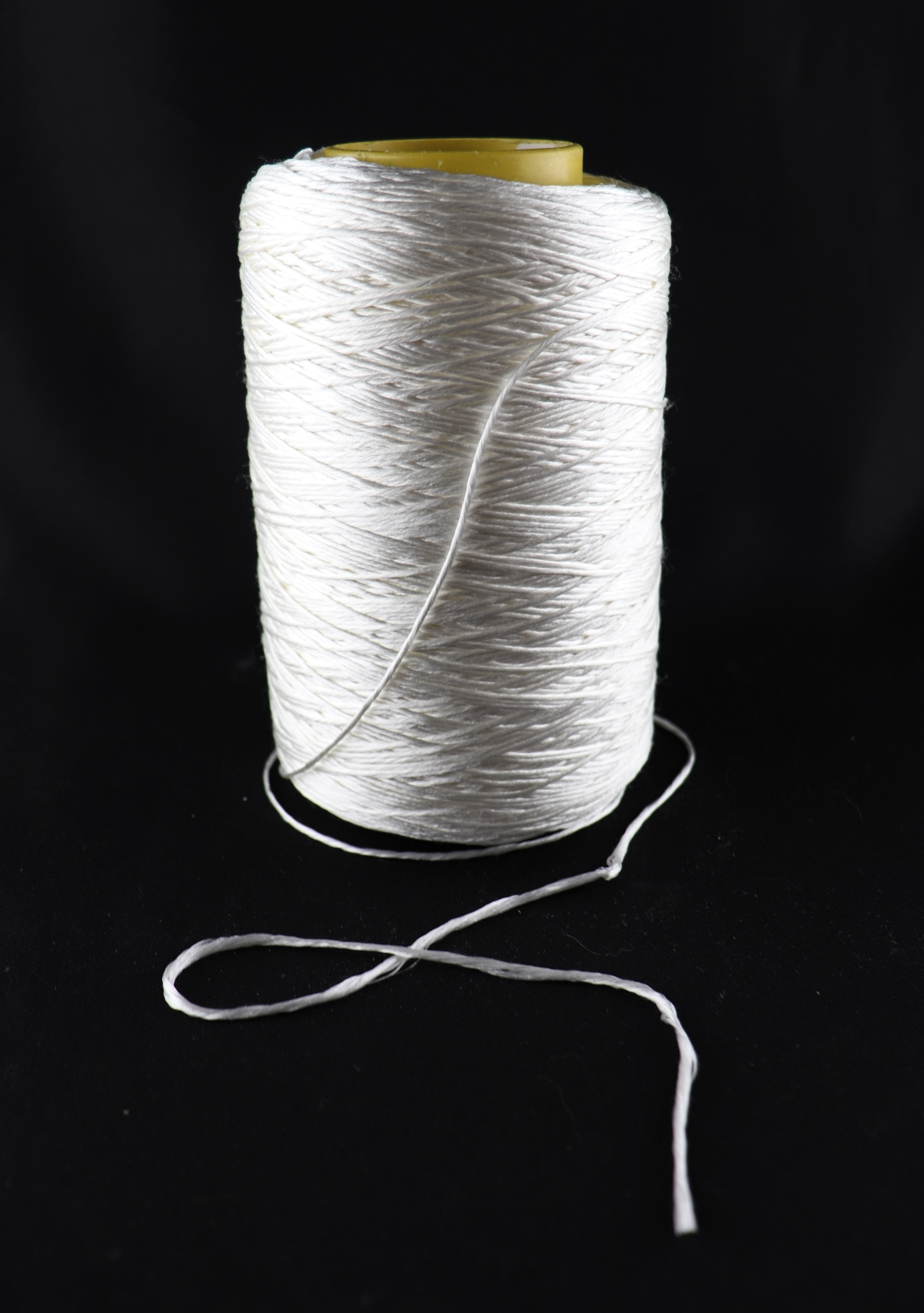 cone of white yarn
