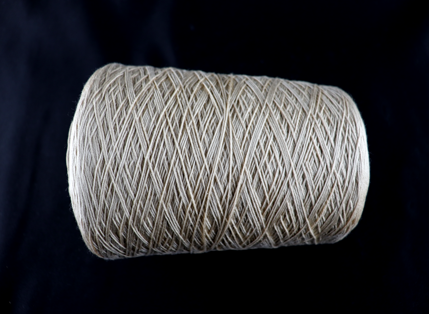 cone of white yarn
