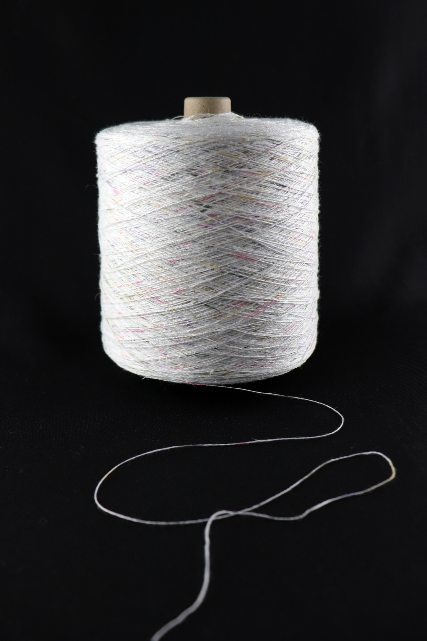cone of white yarn
