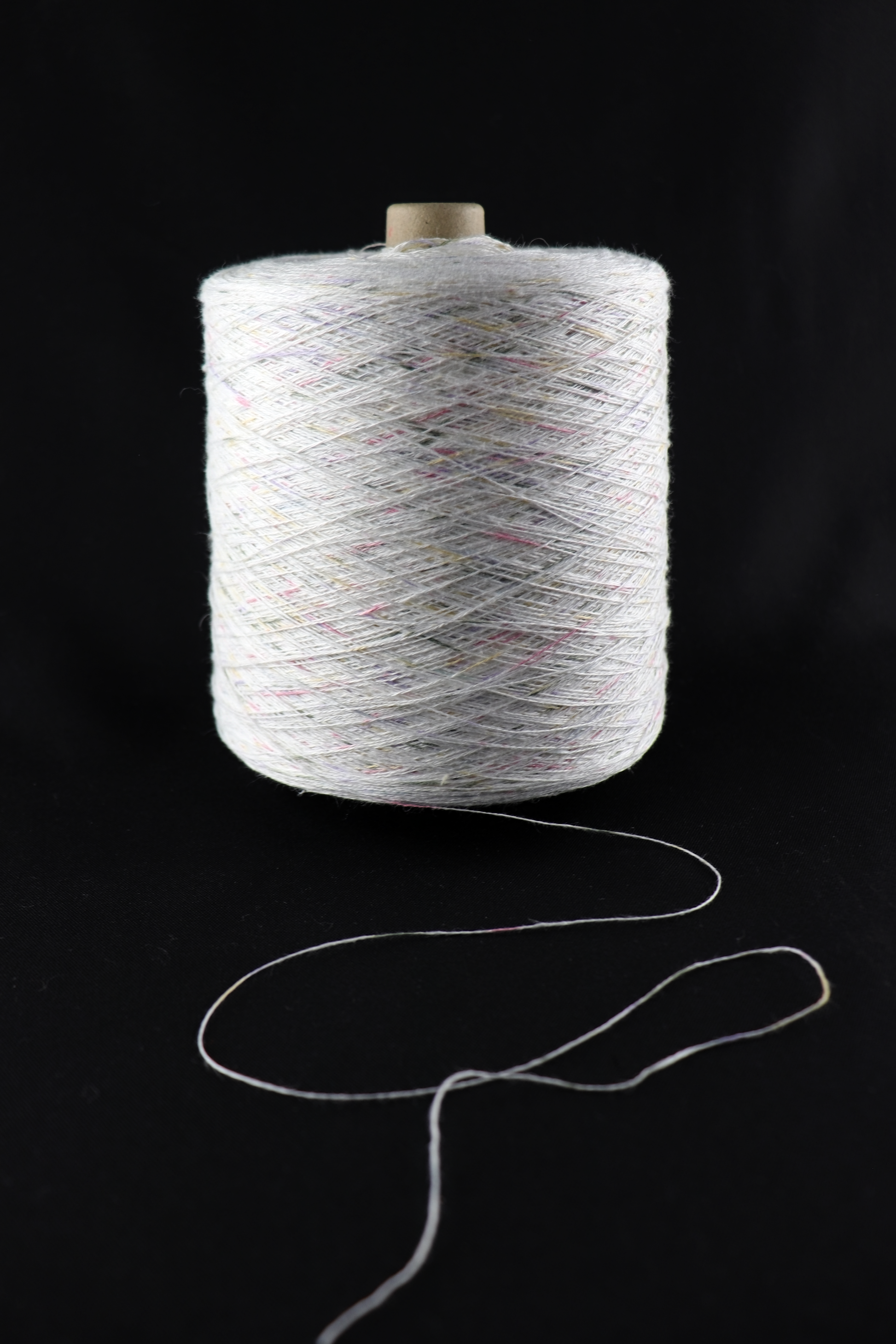 cone of white yarn