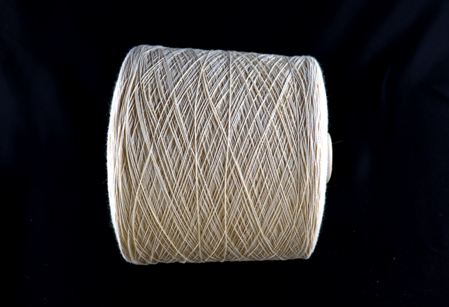 cone of white yarn
