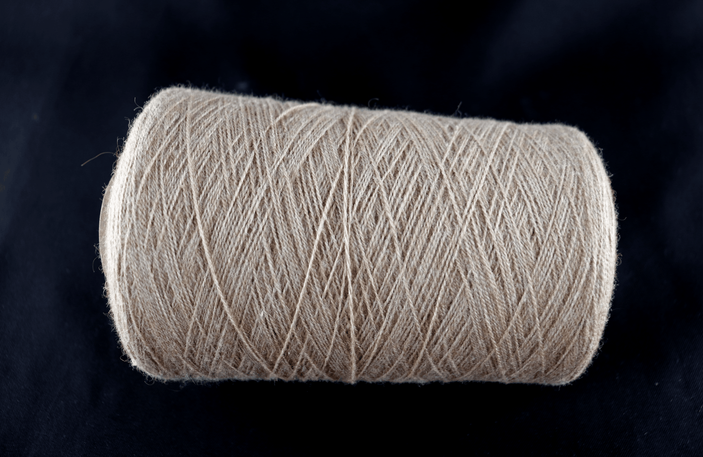 cone of white yarn