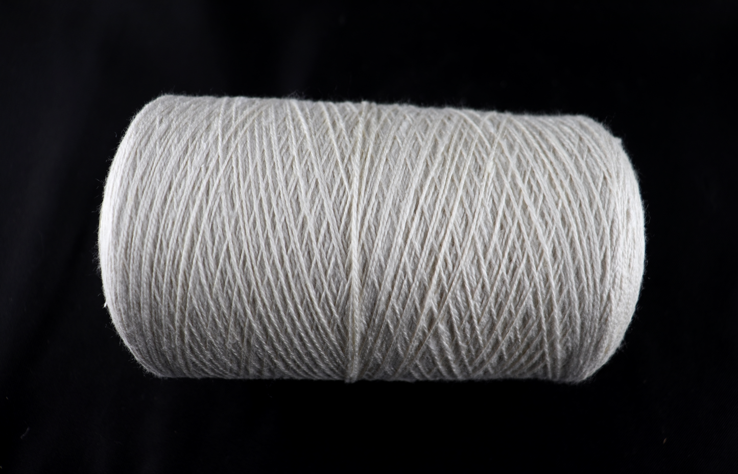cone of white yarn
