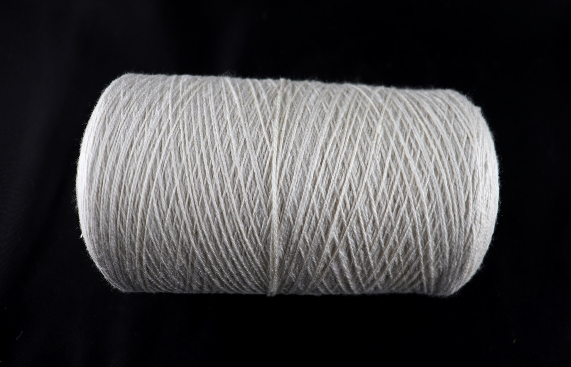cone of white yarn