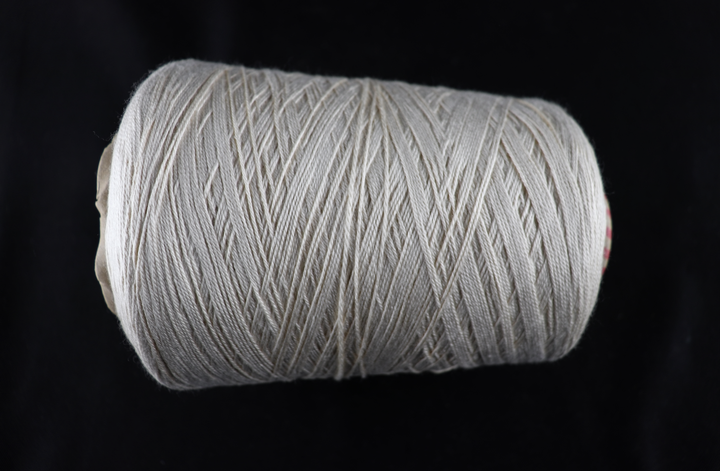 cone of white yarn