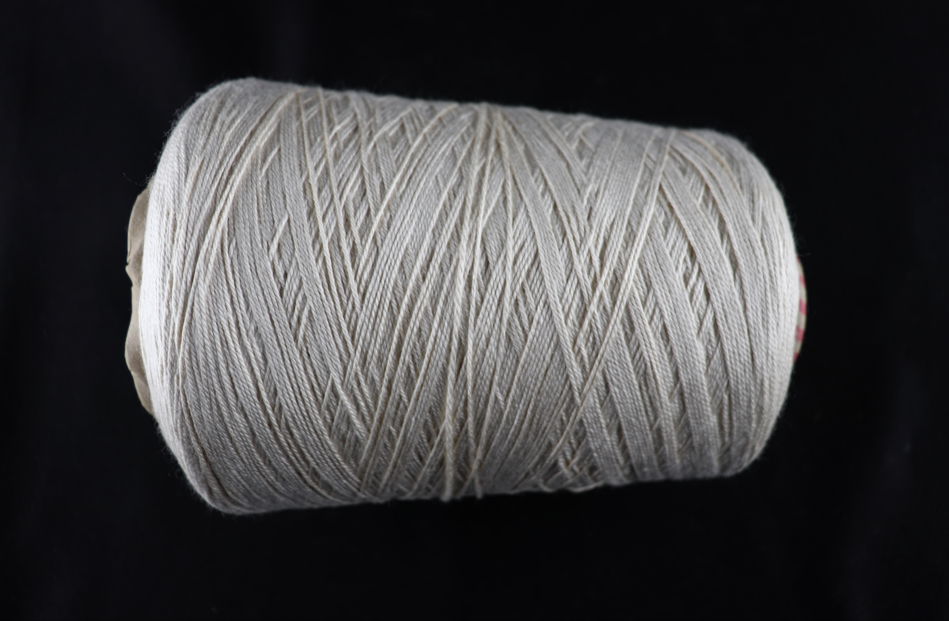 cone of white yarn