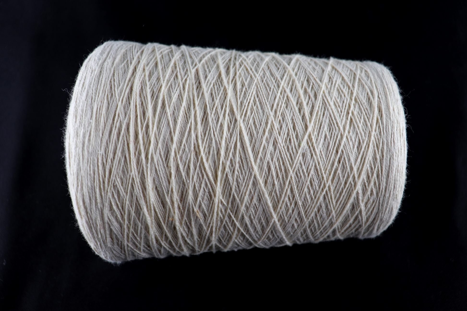 cone of white yarn