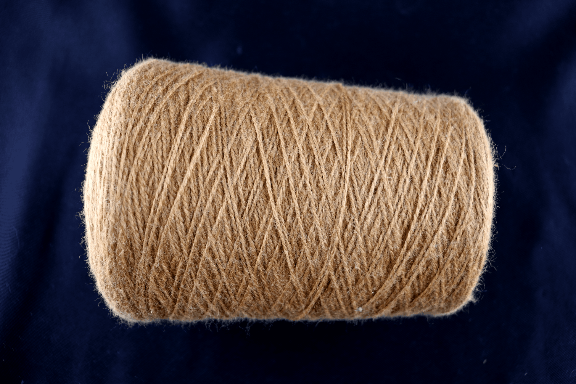 cone of white yarn